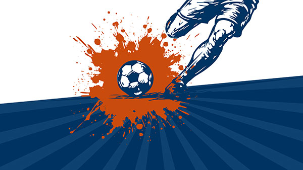 Stylized illustration of a soccer scene: a blue-and-white graphic of a player’s lower body on the right side kicking a soccer ball at center, causing an orange paint splatter effect behind the ball. The ground is dark blue with radiating stripe patterns.