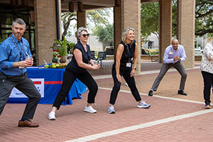 IMG_3867_1 UTMB employees stretch during the walk warm-up