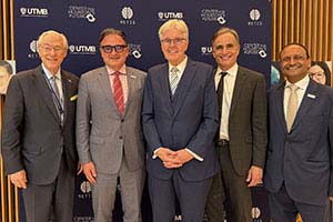 Leaders including UTMB President Jochen Reiser and Lt. Gov. Dan Patrick pose for a group photo