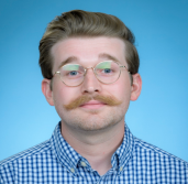 Picture of a man wearing glasses with a mustache