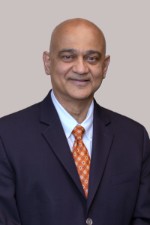 Man wearing a suit smiling