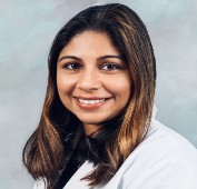 Professional picture of Dr. Vidarshi Muthukumarana wearing a white lab coat