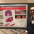 UTMB pathology resident standing beside a research poster presentation on celiac disease and portal hypertension, displayed at a professional medical conference with histology images and clinical findings. Provide your feedback on BizChat