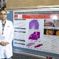 UTMB pathology residents gathered at a conference presenting scientific posters and exchanging ideas with colleagues in a scholarly setting.