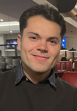 Picture of a man smiling in a restaurant