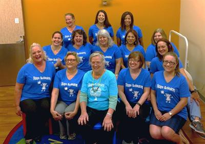 Dr. Sally Robinson (first row, center) and her colleagues wearing “Team Robinson” shirts.