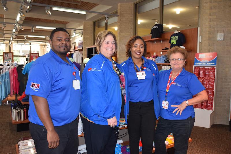 Moore with members of the UTMB Campus Store team: (L-R) Corey Bougere, Leslie Borsellino, Moore and Sandra Low