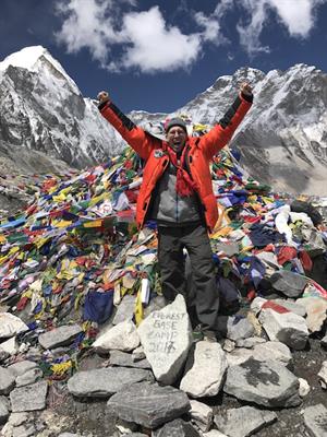 Dr. Harold Pine stands at Everest Base Camp, an elevation of about 17,500 feet