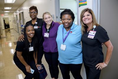 Norris with staff from the Women's Health clinic 