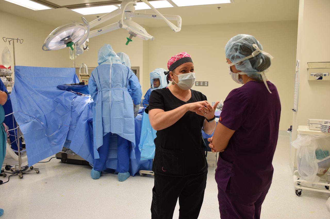 Emily Blomberg (left) shadowed nurse Stacey Robinson during a total knee surgery.