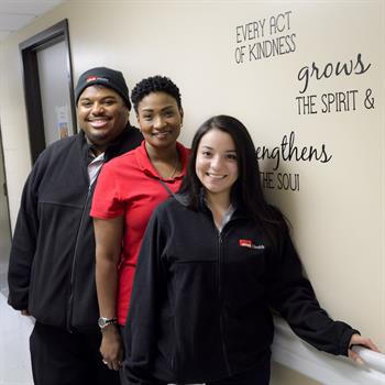 Alexander (left) and Banegas (right) with LaTayna Hill, a patient service specialist in the endoscopy clinic.