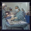 Reaching for instrument off surgical tray