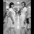 Smiling medical personnel in hospital hallway