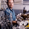 Man in laboratory with gauges and tubing