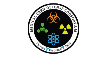 Circular logo for the Medical CBRN Defense Consortium featuring biohazard, radiation, and atomic symbols with the words “Prevent, Diagnose, Treat” around the border.