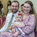 Alpha Omega Alpha attendees with baby on their lap