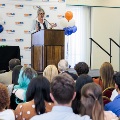 Dr. Rastellini delivering a speech on stage