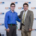 Alpha Omega Alpha Faculty Councilor, Bernard M. Karnath, MD, posing with newly inducted member