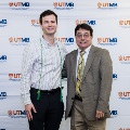 Alpha Omega Alpha Faculty Councilor, Bernard M. Karnath, MD, posing with newly inducted member