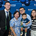 Alpha Omega Alpha Inductee posing with family