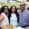Alpha Omega Alpha Inductee posing with family