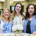 Alpha Omega Alpha Inductee posing with family