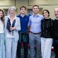 Alpha Omega Alpha Inductee posing with family and faculty