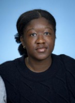 Professional headshot of Abisola Sotade with black hair in a bun, wearing a black top with gray sleeves