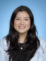 professional headshot of Alyssa Pinon with long black hair, wearing a black top under a white coat