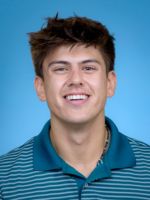 Professional Headshot of Ryan Luib with short brown hair, wearing a teal striped shirt in front of a blue background