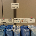 Blue Recycle bags lined up with descriptions of what to put in each.