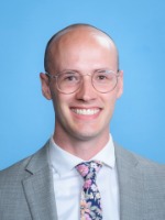 Buhler, Nathan headshot of man in suit, Nathan Buhler