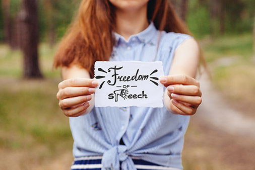 woman holding freedom of expression sign