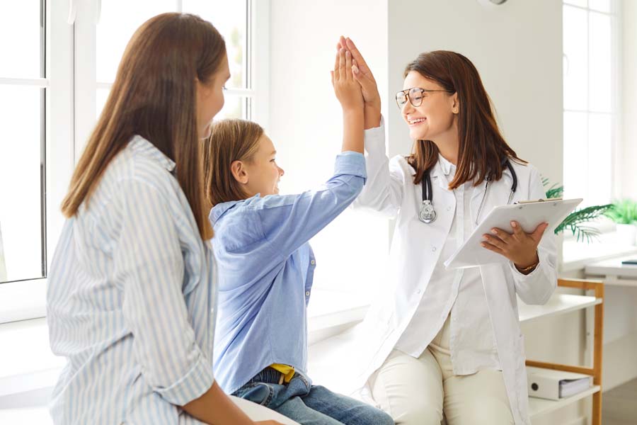 A neurosurgeon reviews brain imaging with a patient while discussing epilepsy surgery options at UTMB Health.