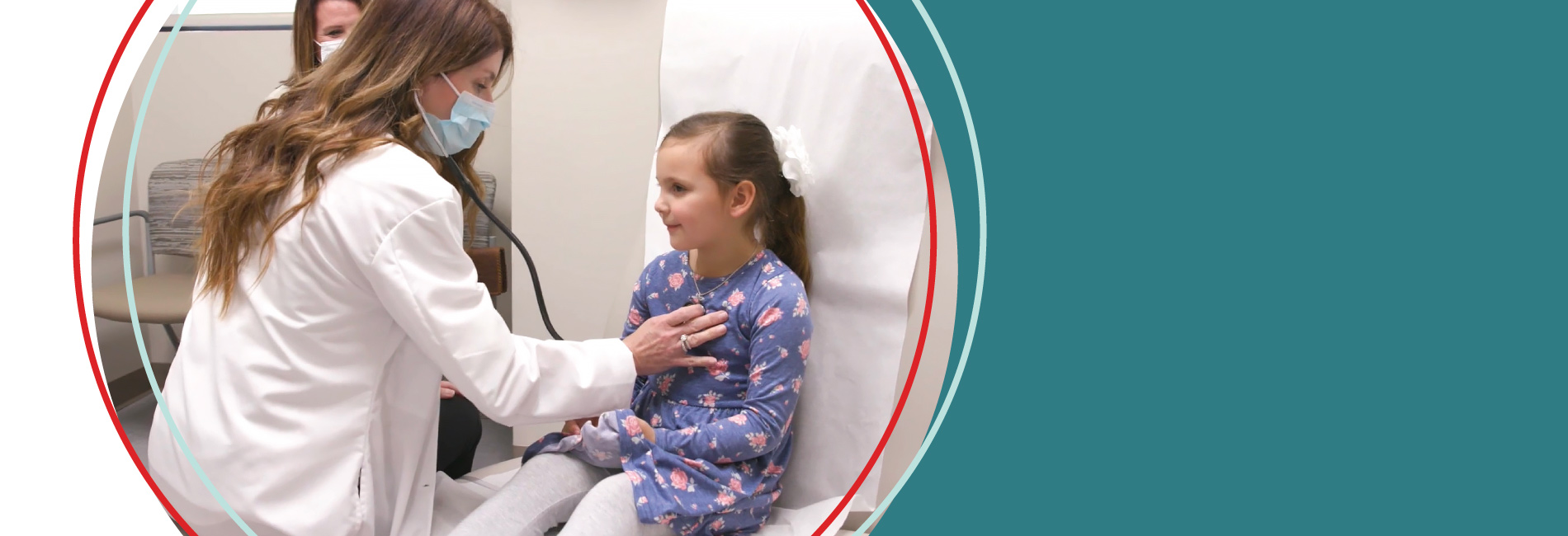 Doctor listening to a girls heart with a stethoscope