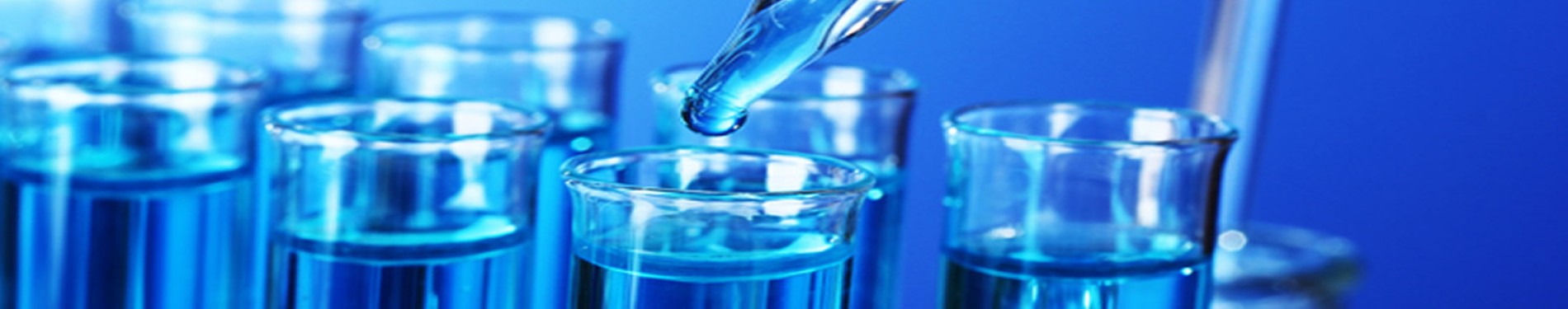 Laboratory test tubes and pipette representing biomedical and clinical research