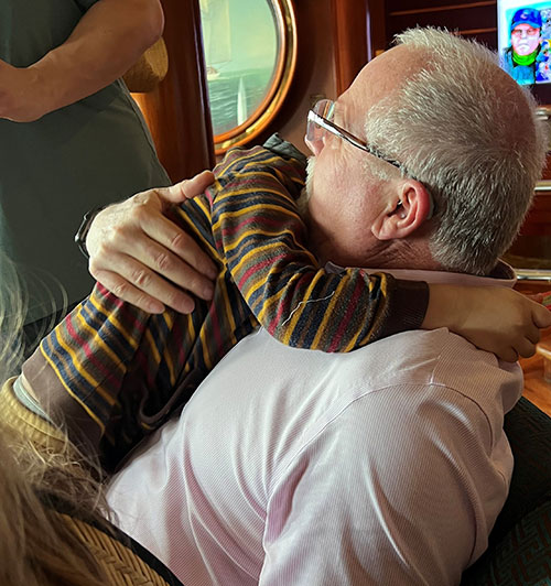 hug-by-boy-and-grand-dad