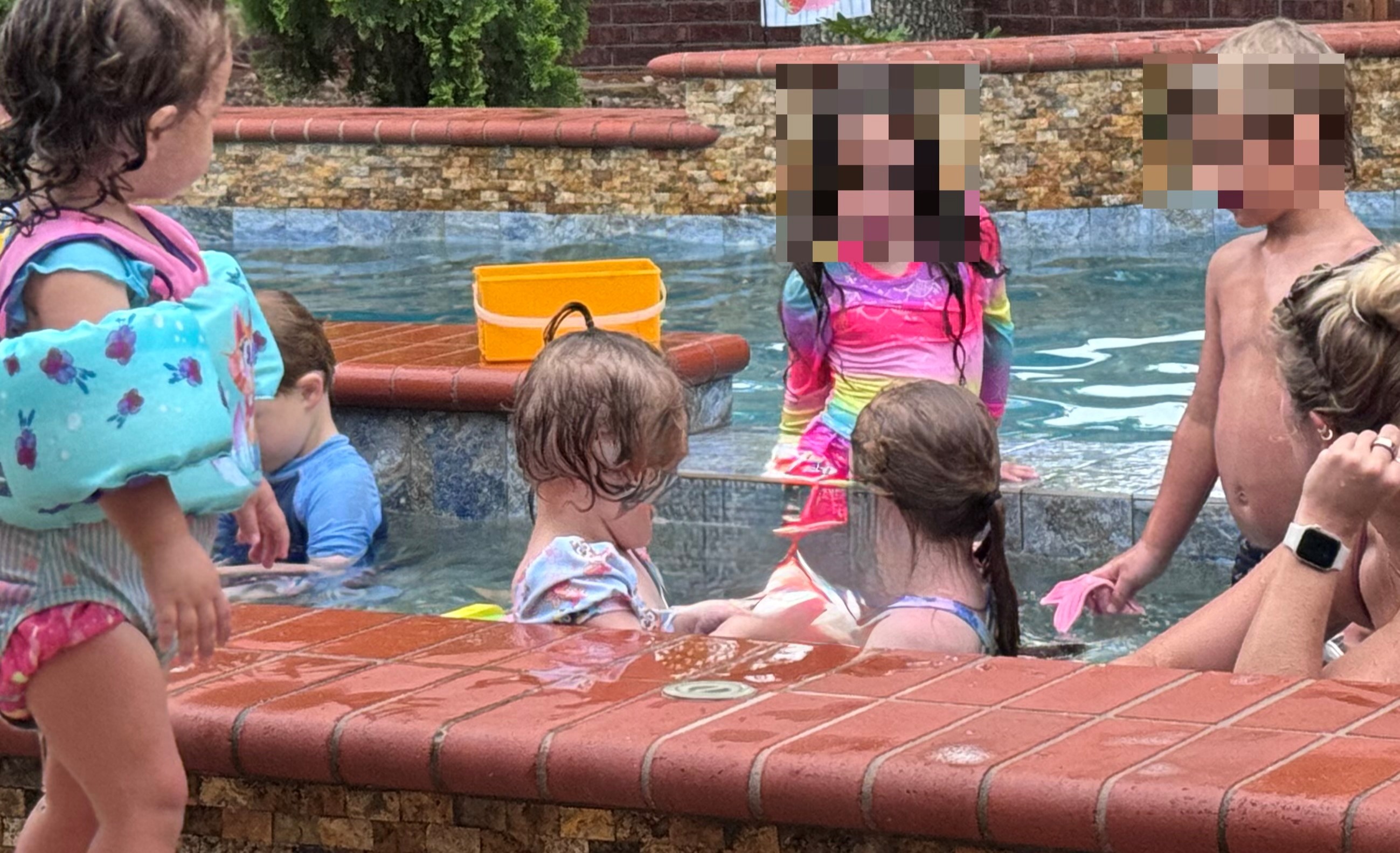 friends playing in pool