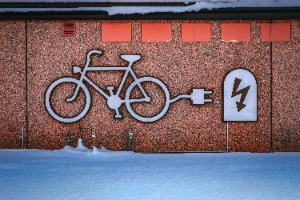small ebike with drawing on cement wall
