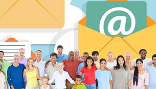 people in front of large envelope with amazon A