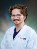 Matthew Craig headshot in white coat