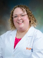 Olivia Moore headshot in white coat