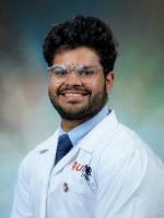 Qamar, Yousuf headshot in white coat