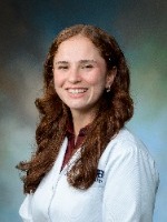 Saritas, Ecem headshot in white coat