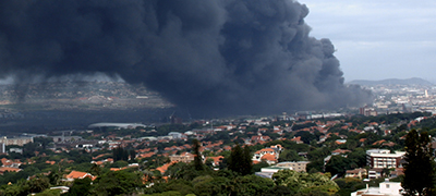 dark black smoke from a city