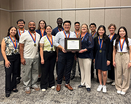Photo of the FMIG group receiving Program of Excellence Award for the 8th Year in a Row