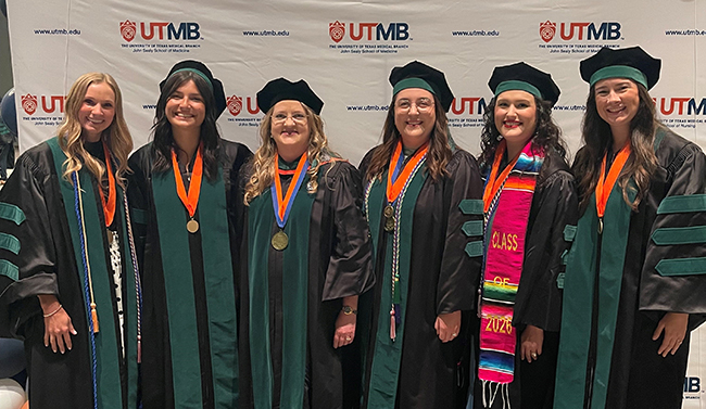 Photo of UTMB Health Family Medicine & Community Health faculty member after delivering  Physicians Oath with student graduates who matched in Family Medicine at the 2026 UTMB JSSOM Graduation Ceremony