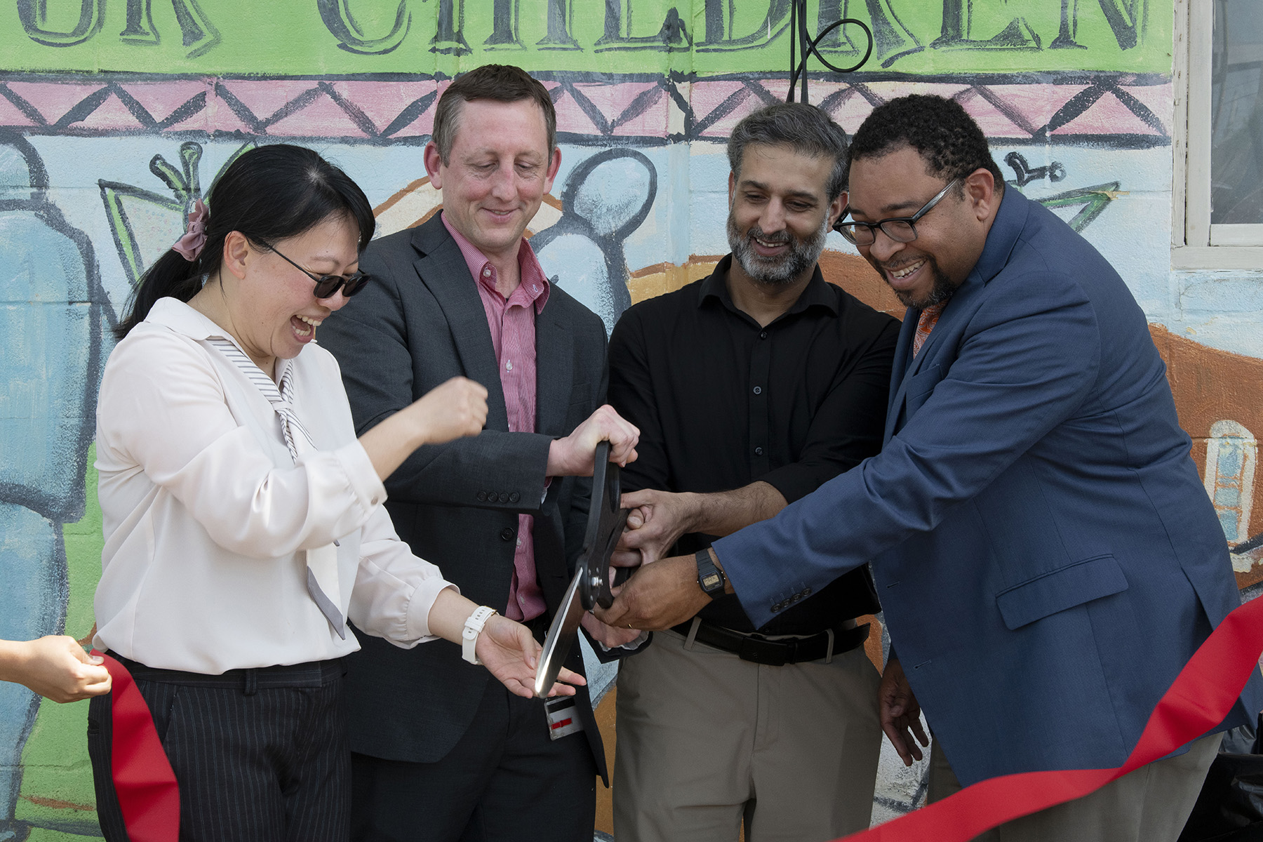 Wei-Chen Lee, Norman Farr, Hasan Yasin and Kendall M. Campbell Cut Ribbon at Grand Opening of the Acupuncture Clinic at St. Vincent's Hope House Clinics