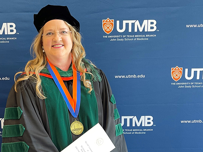 Photo of UTMB Health Family Medicine & Community Health faculty member after delivering  Physicians Oath at the 2026 UTMB JSSOM Graduation Ceremony