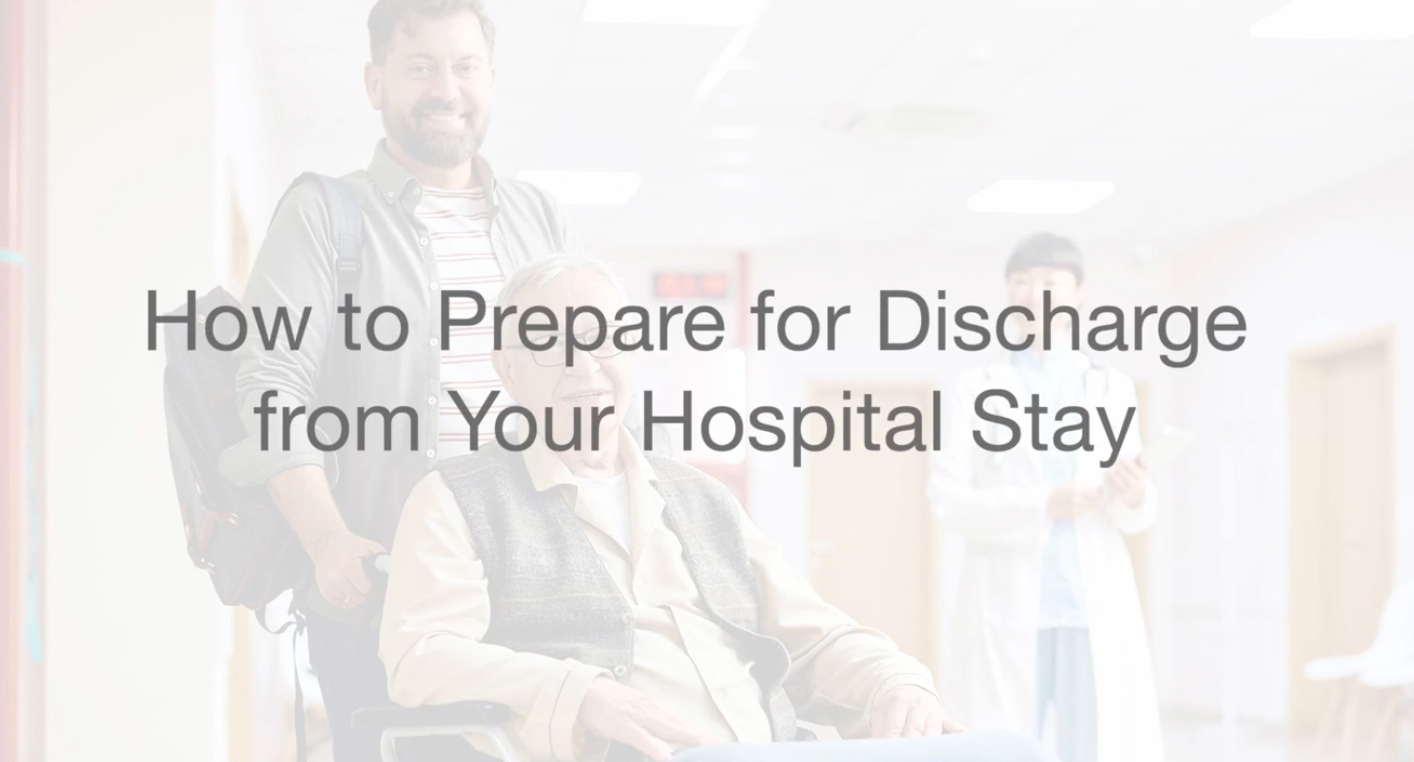 Patient seated in a wheelchair being assisted through a hospital hallway with a staff member in the background and overlaid text reading “How to Prepare for Discharge from Your Hospital Stay.”